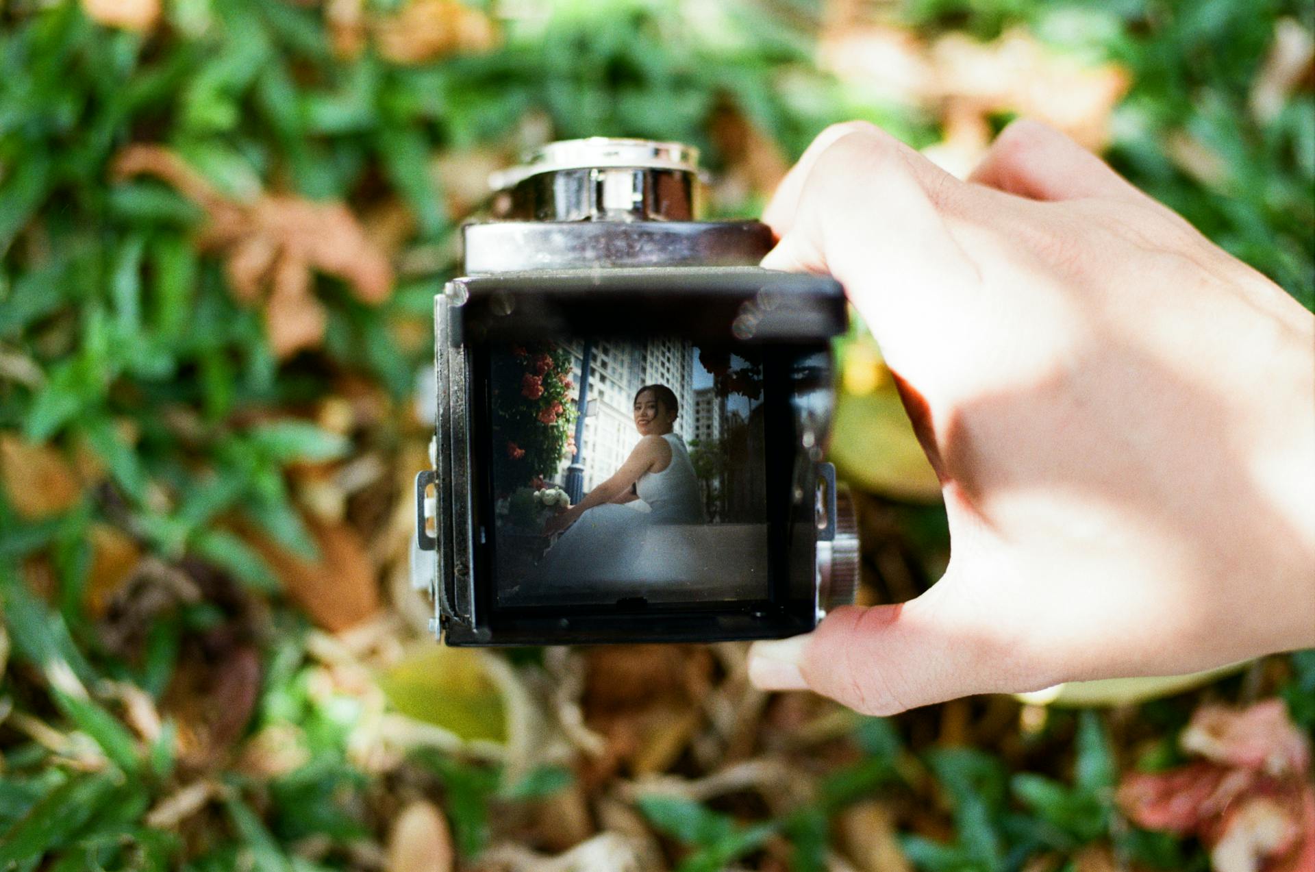 Film wedding photos delivered through a branded OurStoria gallery — Portra 400 tones preserved